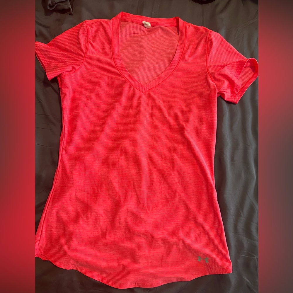 Women’s Under Armour sweat wicking workout top.